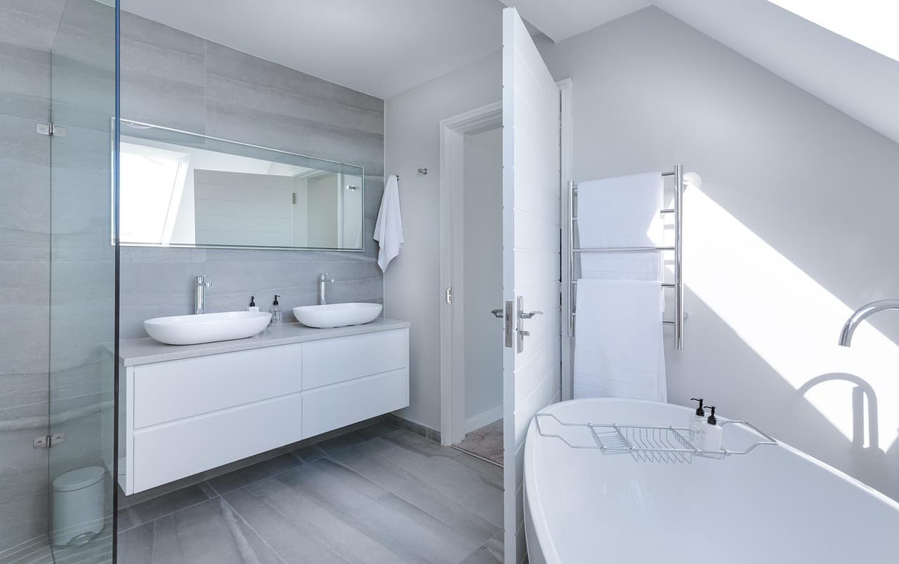 Modern bathroom with twin basins and a freestanding bath